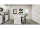 Bright kitchen showcasing a center island with counter seating, stainless steel appliances, and a sleek, modern design at 472 Carolina Springs Blvd, Apex, NC 27539