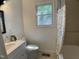 Updated bathroom with modern fixtures, including a tiled bathtub and shower combo at 509 Coleman St, Raleigh, NC 27610