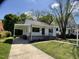 Charming home exterior with a porch, and an attached carport at 509 Coleman St, Raleigh, NC 27610