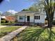 Charming home exterior with a porch and a walkway lined with flowers at 509 Coleman St, Raleigh, NC 27610