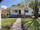 Charming, renovated one-story home featuring fresh landscaping and a welcoming walkway to the front door at 509 Coleman St, Raleigh, NC 27610