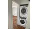 Stackable washer and dryer inside of a closet, next to a bedroom at 509 Coleman St, Raleigh, NC 27610