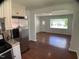 Open living space with hardwood floors and a view to the outside at 509 Coleman St, Raleigh, NC 27610
