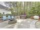 A backyard with a firepit, hot tub, and a white bench at 5301 Night Heron Dr, Wake Forest, NC 27587