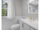Bathroom features a white vanity with gold fixtures, a toilet, and a window with natural light at 5301 Night Heron Dr, Wake Forest, NC 27587