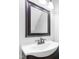 Bathroom sink with vanity, bronze faucet and mirror with dark brown trim at 5301 Night Heron Dr, Wake Forest, NC 27587