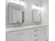 Bright bathroom with double sink vanity, marble countertops, gold fixtures and mirrors at 5301 Night Heron Dr, Wake Forest, NC 27587