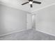 Neutral bedroom has carpet, a ceiling fan, and open door that shows another room at 5301 Night Heron Dr, Wake Forest, NC 27587