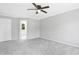Carpeted bedroom with ceiling fan, white trim, and access to another room at 5301 Night Heron Dr, Wake Forest, NC 27587
