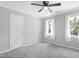 Inviting bedroom features neutral walls, carpet, a ceiling fan, and bright natural light at 5301 Night Heron Dr, Wake Forest, NC 27587