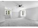 Bonus room has carpet and a ceiling fan, along with two windows at 5301 Night Heron Dr, Wake Forest, NC 27587