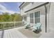 Relax on this beautiful deck with white wood and calming teal chairs at 5301 Night Heron Dr, Wake Forest, NC 27587