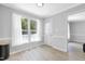 Bright dining area with wood-look floors, large window, and white trim and door at 5301 Night Heron Dr, Wake Forest, NC 27587