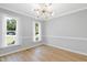 Bright dining room featuring modern lighting, neutral walls, and hardwood flooring at 5301 Night Heron Dr, Wake Forest, NC 27587