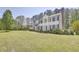 Traditional white home with black shutters, a brick chimney and a manicured lawn at 5301 Night Heron Dr, Wake Forest, NC 27587