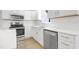 Well-equipped kitchen featuring stainless steel appliances, white cabinets, and stylish countertops at 5301 Night Heron Dr, Wake Forest, NC 27587
