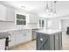 Bright kitchen featuring stainless steel appliances, white cabinets, and stylish countertops at 5301 Night Heron Dr, Wake Forest, NC 27587