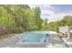 Backyard swimming pool surrounded by lush trees at 5301 Night Heron Dr, Wake Forest, NC 27587