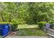 Private backyard with lush landscaping and mature trees at 5318 Crescentview Pkwy, Raleigh, NC 27606