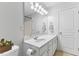 Elegant bathroom featuring a white vanity, modern lighting, and ample counter space at 5318 Crescentview Pkwy, Raleigh, NC 27606