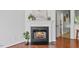 Bright living room featuring a fireplace with white mantel, and decorative wall art at 5318 Crescentview Pkwy, Raleigh, NC 27606