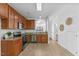 Open kitchen with stainless steel appliances, wood cabinets, and granite countertops at 5318 Crescentview Pkwy, Raleigh, NC 27606