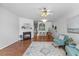 Cozy living room featuring a fireplace, ceiling fan, and natural light at 5318 Crescentview Pkwy, Raleigh, NC 27606