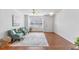 Bright and airy living room with wood floors and neutral decor at 5318 Crescentview Pkwy, Raleigh, NC 27606