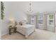 Bright main bedroom with a chandelier, neutral walls, and carpet with natural light at 5318 Crescentview Pkwy, Raleigh, NC 27606