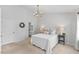 Bright main bedroom with neutral walls, carpet, and a chandelier at 5318 Crescentview Pkwy, Raleigh, NC 27606