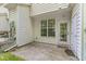 Covered back patio with a full glass door at 5318 Crescentview Pkwy, Raleigh, NC 27606