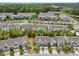 Aerial view highlighting a neighborhood of well-maintained homes with manicured lawns and tree-lined streets at 5518 Jessip St, Morrisville, NC 27560