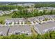 High angle aerial shot of a residential area with townhouses, tidy landscaping, and ample parking at 5518 Jessip St, Morrisville, NC 27560