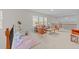 Cozy upstairs living room area with comfortable seating and natural light from the surrounding windows at 5518 Jessip St, Morrisville, NC 27560