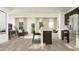 Open-concept living space featuring luxury vinyl plank flooring and lots of natural light at 615 Cassa Clubhouse Way, Knightdale, NC 27545