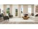 Open living space featuring hardwood flooring and lots of natural light at 615 Cassa Clubhouse Way, Knightdale, NC 27545