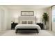 A stylish bedroom offers a comfy bed with accent pillows and two nightstands at 617 Cassa Clubhouse Way, Knightdale, NC 27545