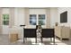 Bright and airy living room with modern furniture and views to the outside at 617 Cassa Clubhouse Way, Knightdale, NC 27545