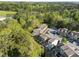 A serene aerial view of townhomes nestled among mature trees and landscaping at 6230 Pesta Ct, Raleigh, NC 27612