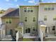 Exterior backyard view of the home with a patio and seating area ideal for relaxation and entertaining at 6230 Pesta Ct, Raleigh, NC 27612
