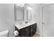 Bathroom featuring double sink vanity with undermount sinks and framed mirrors at 6230 Pesta Ct, Raleigh, NC 27612