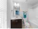 Bathroom featuring modern vanity with tub and shower combo at 6230 Pesta Ct, Raleigh, NC 27612