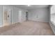 Bright bedroom features neutral carpet, freshly painted walls, and multiple entryways for easy access at 6230 Pesta Ct, Raleigh, NC 27612