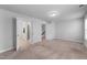 Spacious bedroom with neutral carpet, white walls and multiple doors and an ensuite bath at 6230 Pesta Ct, Raleigh, NC 27612