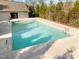 A close up image of a rectangular community pool with a concrete deck and fencing at 6230 Pesta Ct, Raleigh, NC 27612