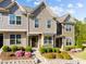 Exterior of attractive townhomes featuring well-maintained landscaping and a welcoming entryway at 6230 Pesta Ct, Raleigh, NC 27612