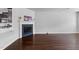 Open-concept living area with hardwood floors and fireplace perfect for entertaining guests at 6230 Pesta Ct, Raleigh, NC 27612