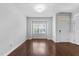 Sunlit living room with hardwood floors, a large window, and fresh paint perfect for relaxing or entertaining at 6230 Pesta Ct, Raleigh, NC 27612