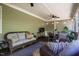 Cozy back porch with a seating area, dining area, a ceiling fan, and natural light at 658 Bennett Mountain Trce, Chapel Hill, NC 27516