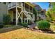 The home has a lovely backyard, a patio area, a deck, and mature landscaping at 658 Bennett Mountain Trce, Chapel Hill, NC 27516